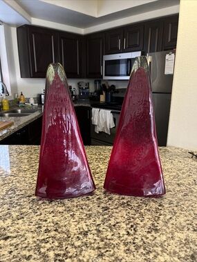 Decorative red glass sculptures pair